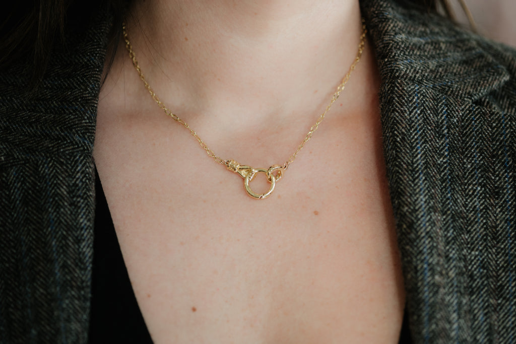 Hand Holding Circle Necklace